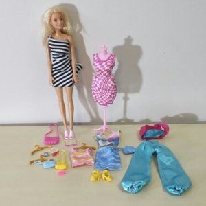 Barbie doll with clothes and accessories